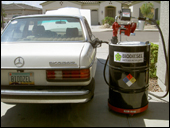 ATLAS BIO pumping biodiesel into 1981 mercedes 240d bio-diesel alternative fuel vehicle 26 miles per gallon mpg clean burning