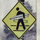 East Valley Tribune article 2002 showing a pedestrian sign with lit fuze surfboard sticker in Flagstaff Arizona fLANSBURG dESIGN