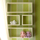 custom wall boxes and shelves with seamless floating effect against green blue and white pinstrip wall fLANSBURG dESIGN